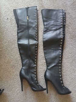 Black and gold thigh high boots