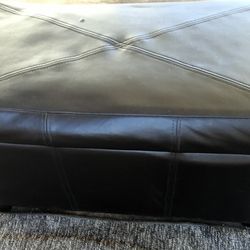Black faux leather storage bench
