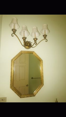 Gold mirror and light fixture