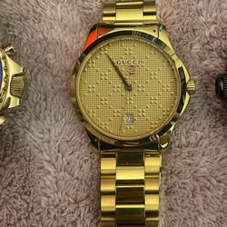 1 Michael Kors, 1 Gucci Date