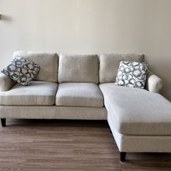Living Spaces Emery Chiffon Beige Fabric 84” Sectional Sofa With Reversible Chaise