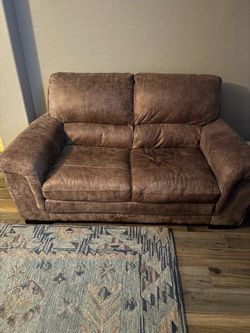 Real leather couches and ottoman