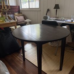 Round table, dark wood finish 35in diameter