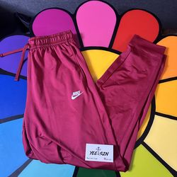 Nike burgundy track pants Size Large, used