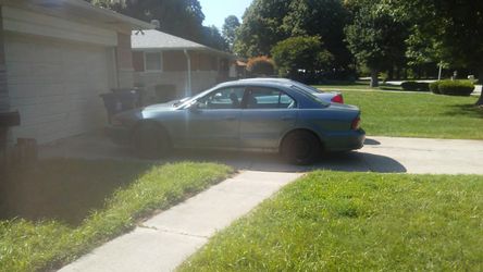 Mitsubishi title in hand