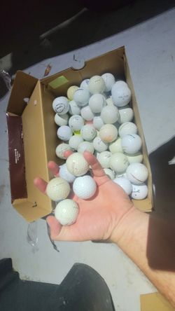 Assorted used golf balls. Random names and conditions.