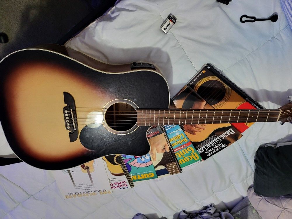 Electric acoustic guitar set includes guitar, case,strap, guitar books, capo, pics
