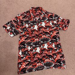 Vibrant mushroom print in red, black, and white. Short sleeve button-down for casual wear. Bold graphic pattern for standout style.  Bundle deals avai