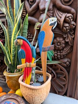 Carved wood parrots