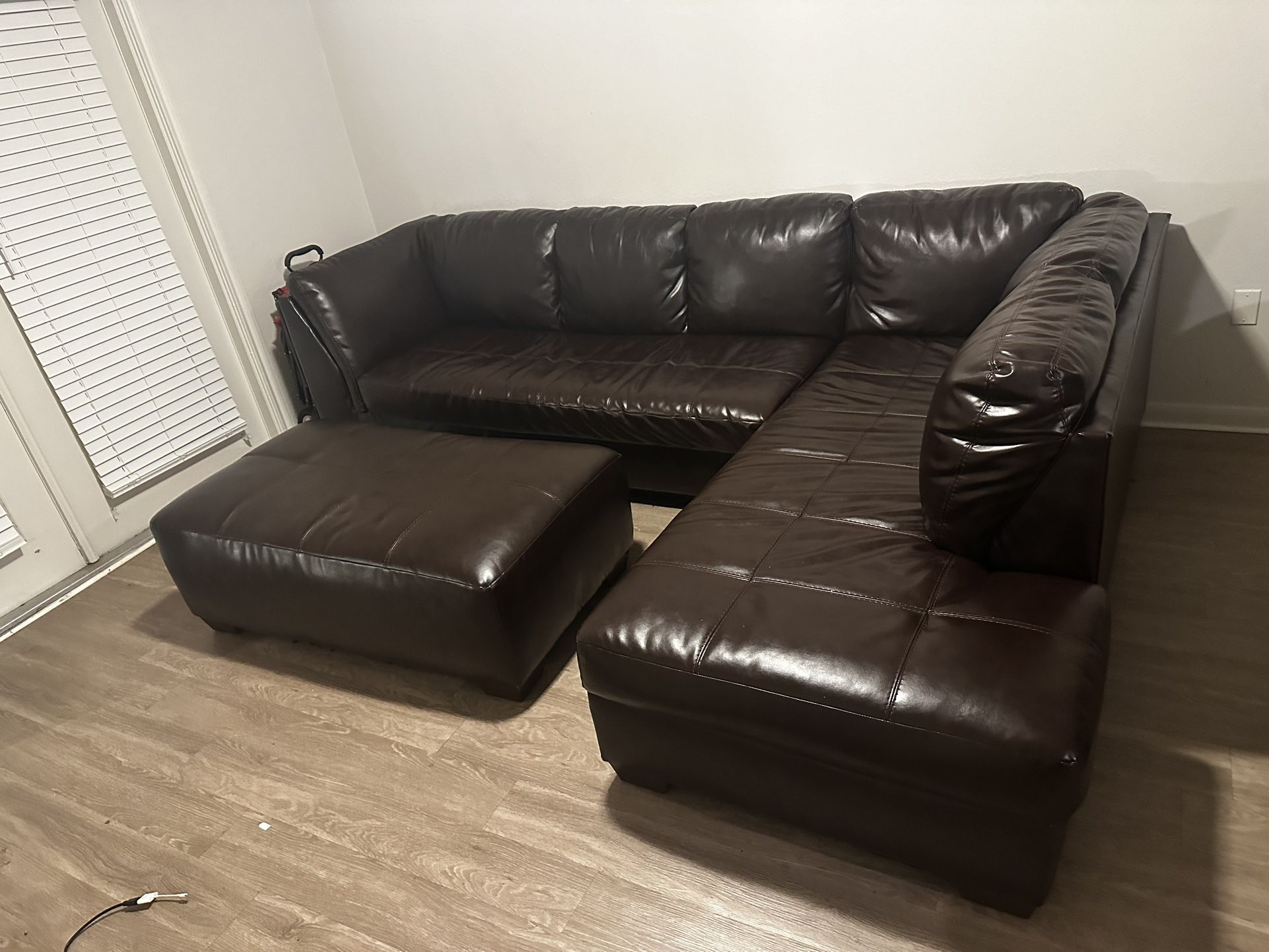 Brown Leather Sectional Couch & ottoman 