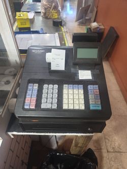 Sharp Cash register with receipt paper rolls