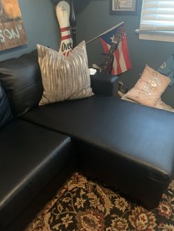 Black faux leather sectional