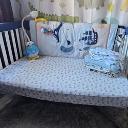 Crib, mattress, sheets, blankets, curtain, crib protector and mobile for baby