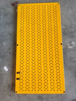Yellow Metal Pegboard Panel