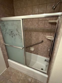 Cast iron bath tub with glass shower doors