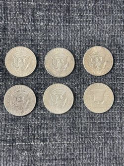 John F. Kennedy have silver dollar with one Benjamin Franklin half dollar