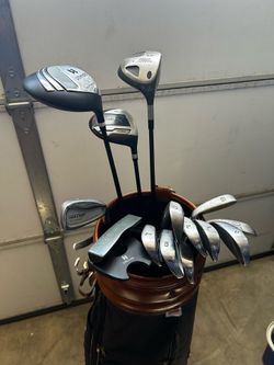 Random golf clubs + Wilson bag