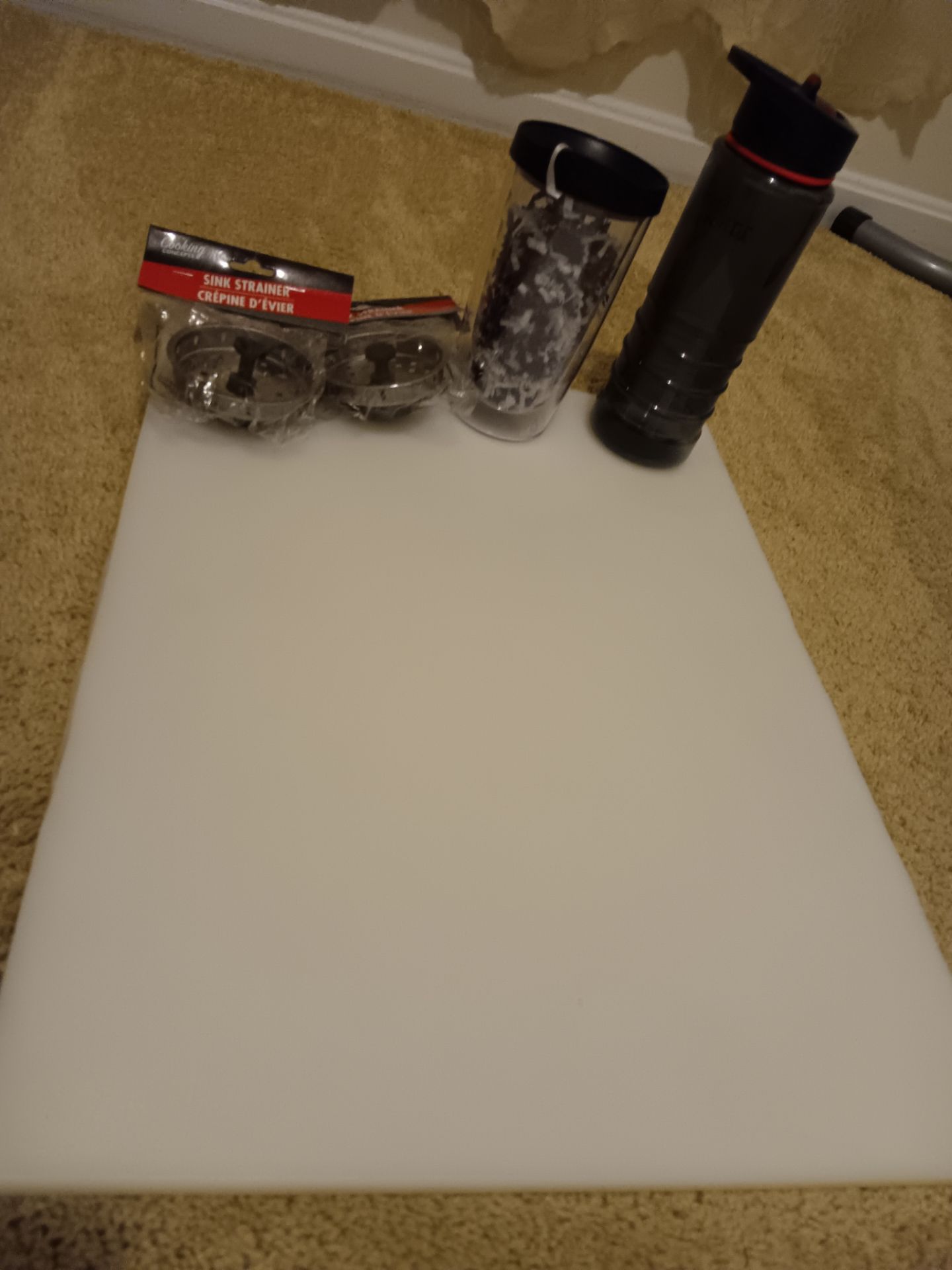 Free water bottles, sink stopper, cutting board