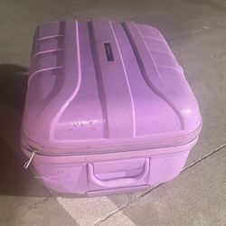 Calpak hardside spinner luggage bag in purple.