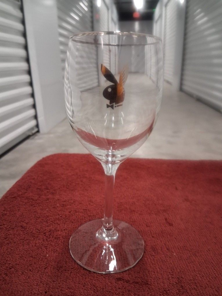 STRAIGHT OUT OF HUGH HEFFNORS MANSION, THESE CRYSTAL WINE GLASSES ETCHED WITH THE PLAYBOY MAGAZINES BUNNY IN STERLING SLIVER ARE A MUST HAVE GREATDEAL