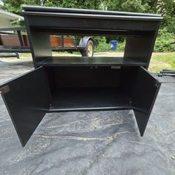 full size bed and rotating TV stand