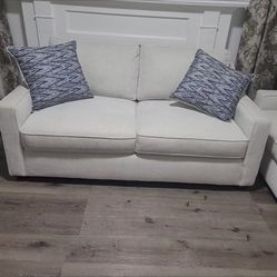 Three white and new couches. 2 large and 1 small, pillows included