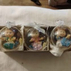 Cabbage Patch Kids Lil Sprouts Christmas holiday ornaments featuring miniature dolls enclosed in cle