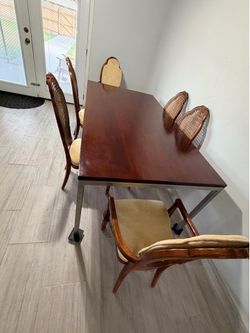 Very strong wood dining table and six chairs