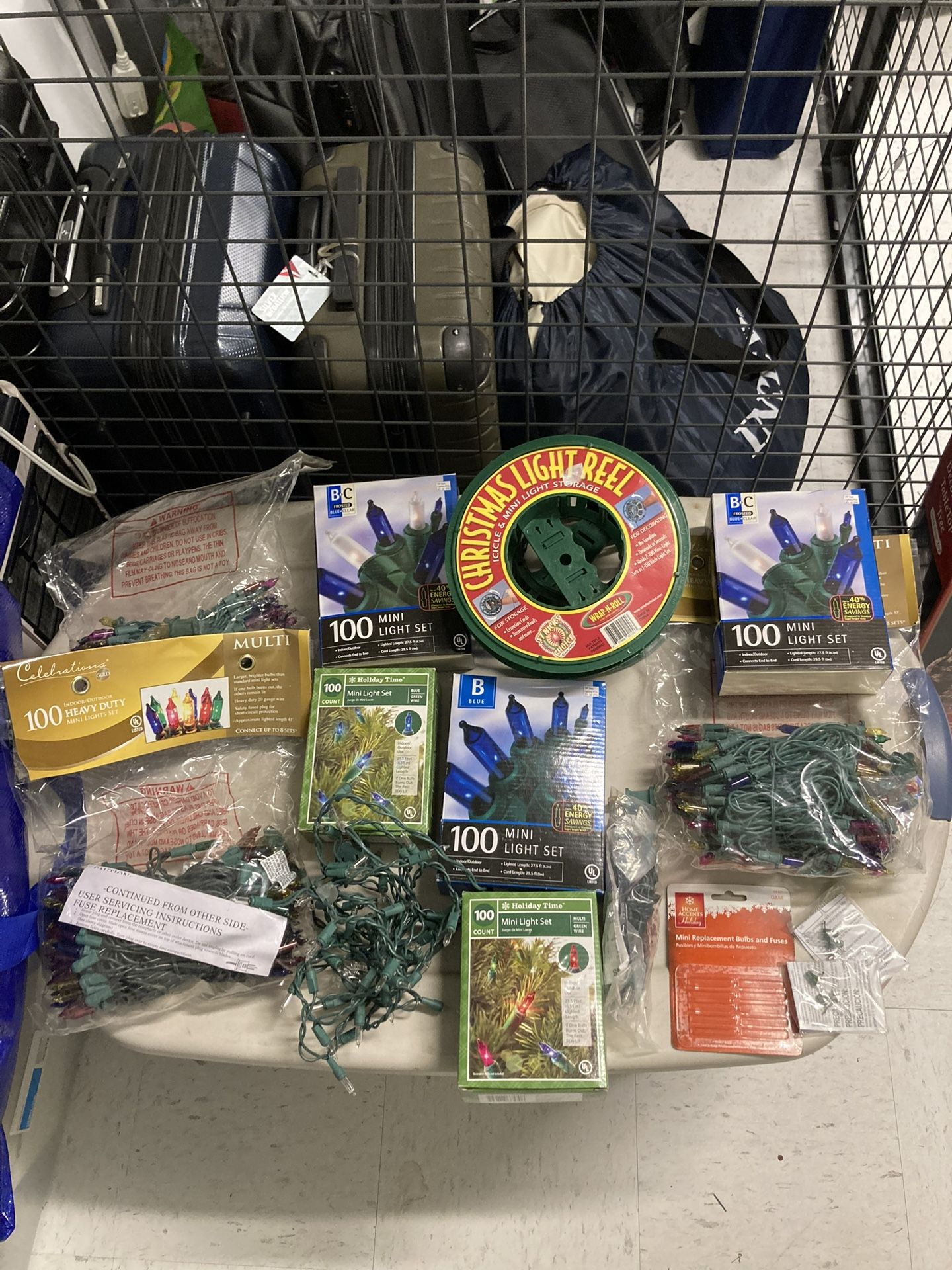 Various color Christmas lights, replacement bulbs and storage wheels- 12 count