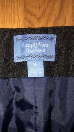 Vera Wang size 6 black lace pencil skirt with a navy ribbon & bow at the waist and has a slit in the back. Zips up the side