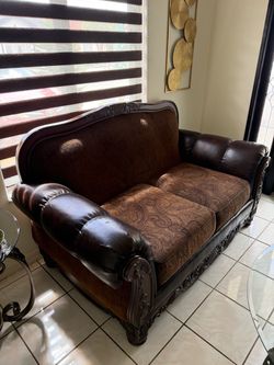 Jacquard clothe and leather love seat.