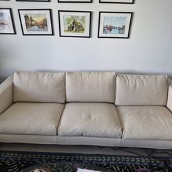 Thayer Coggin Get Down Sofa, originally designed by Milo Baughman in 1964. It features a distinctive modern design with clean lines, square arms, and