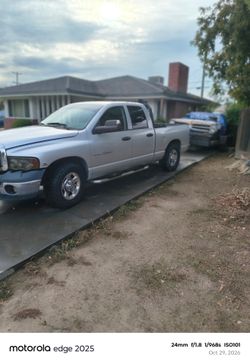 2005 Dodge Cummins with 8 lug hydraulic car trailer