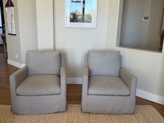 Two World Market Gray Swivel Chairs