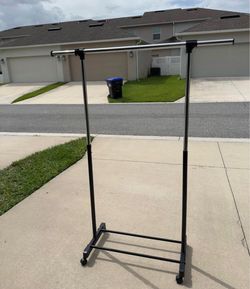 Selling a black clothing rack.