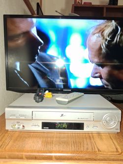 Zenith, VCR with remote and cable.  Works fine.
