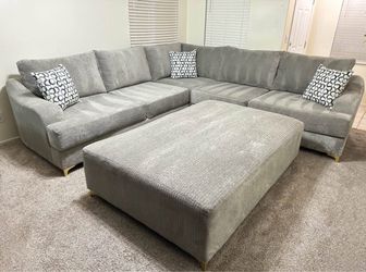 Light gray sectional with ottoman