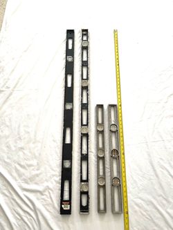 Vintage and modern 4ft and 24” levels. Total of four.