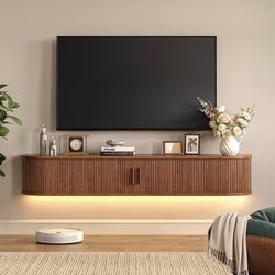63" Floating TV Stand with Power Outlet for TVs up to 75", Fluted Entertainment Center with Remote Control for LED Lights, Mid-Century Modern TV Conso