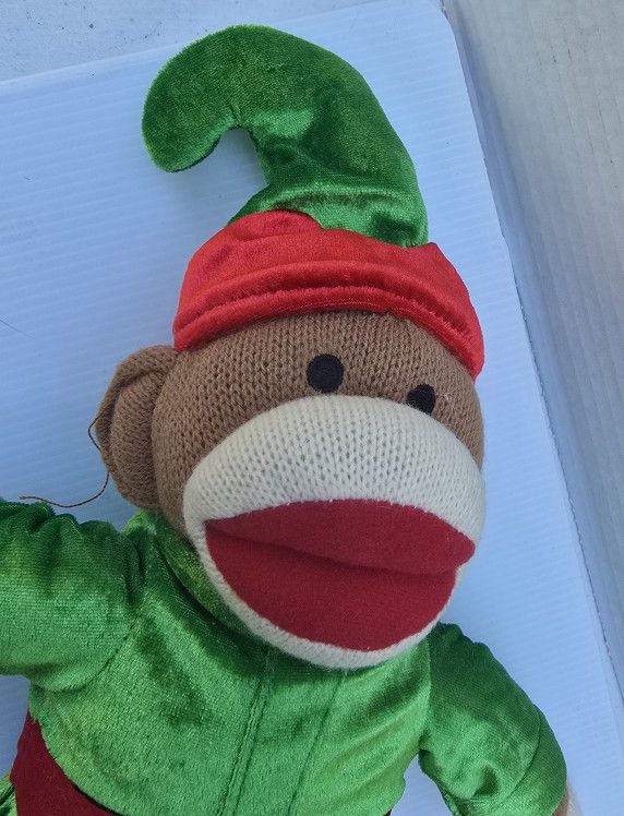Sock monkey plush in elf outfit