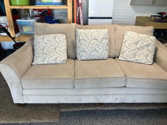 Matching couch, chair and ottoman.