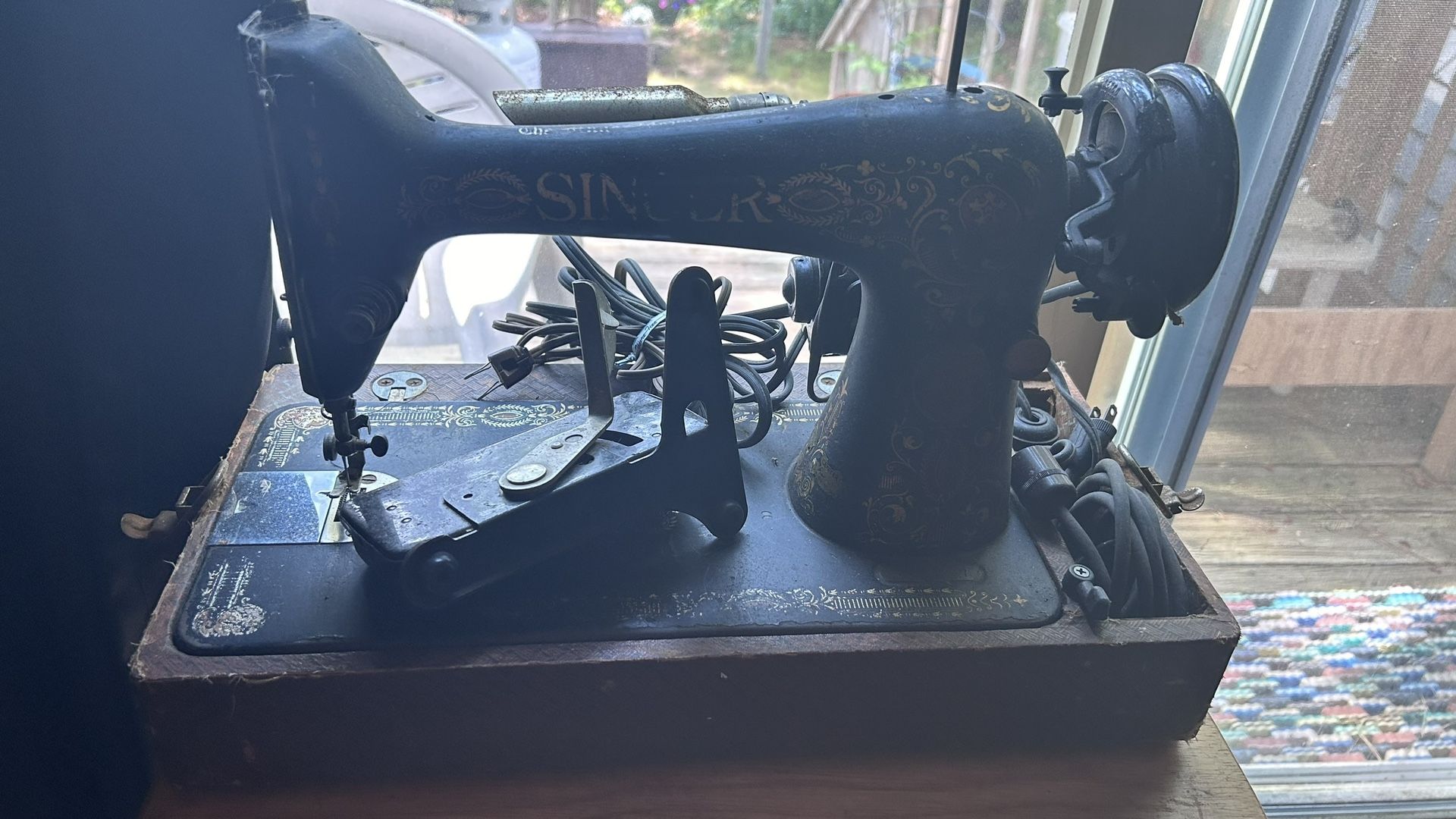Two Singer Sewing Machines. One Older, One Newer.