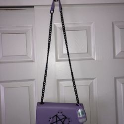 Black Craft purse with hand sanitizer