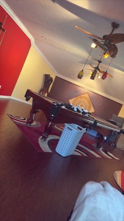 Pool table with balls,sticks, and stand