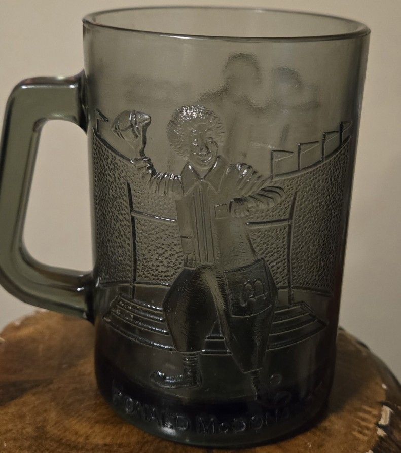 Vintage Ronald McDonald Smoked Glass Mug With Ronald McDonald Holding A Football. Circa 1990s.