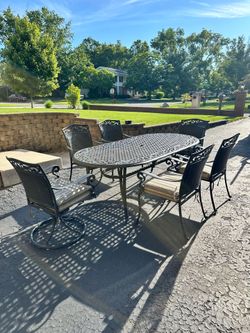 Patio set, 42x82 aluminum table with 6 chairs, 2 of them swivel, delivery available for extra cost