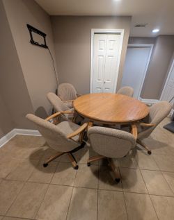Round Dining Table Set with 6 Rolling Upholstered Chairs