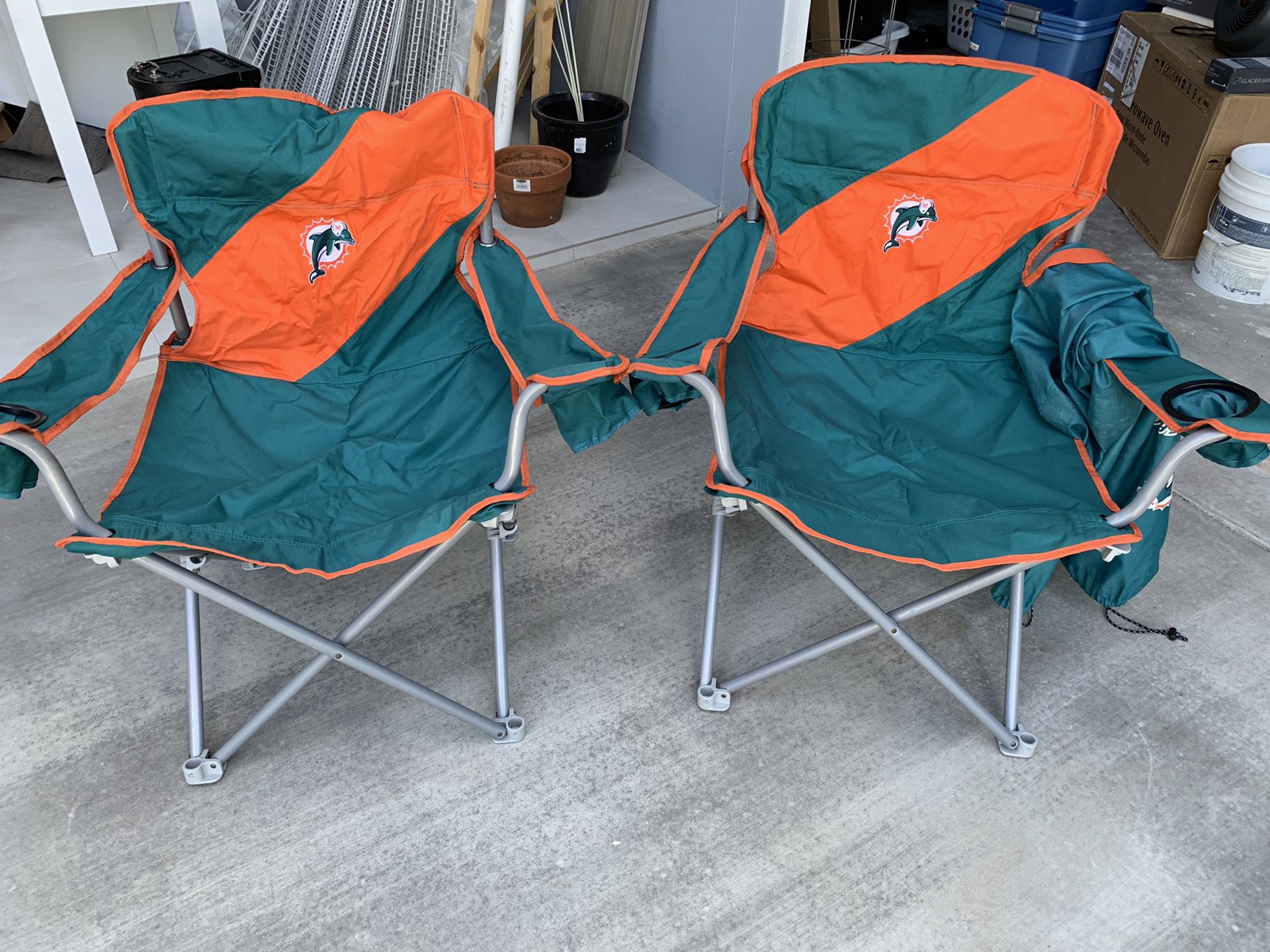 Dolphins folding chairs. Never used. . $50 both. Pick up in Jupiter