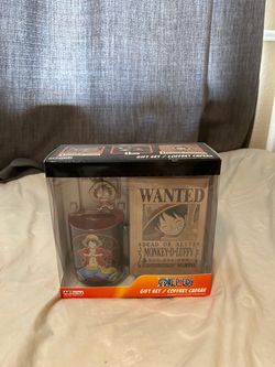 One Piece book, coffee cup and key chain