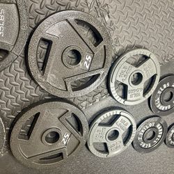 BRAND NEW Full Olympic  Weights Set of Plates: 45s, 35s, 25s, 10s, 5s and 2.5 pounders . Brute: 245 #
